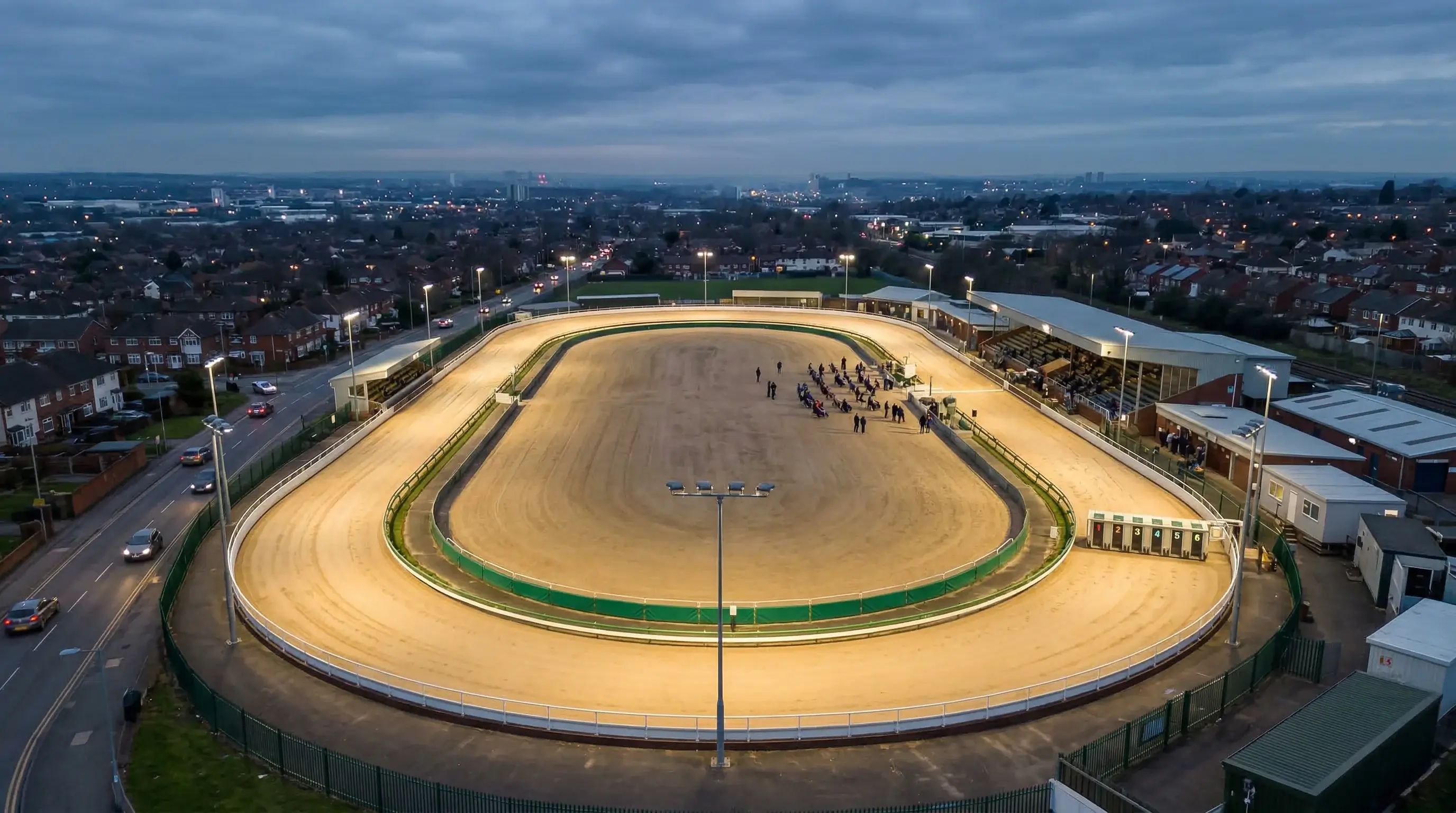 Perry Barr greyhound stadium Birmingham with floodlit track and spectator stands